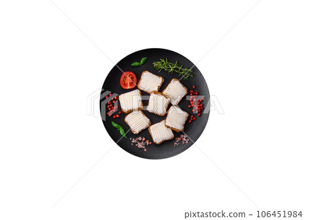 Delicious salty rectangular wheat croutons with cream cheese and tomatoes 106451984