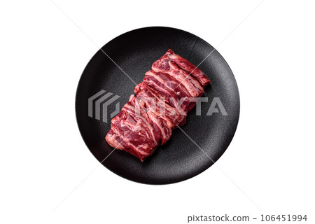 Fresh raw beef ribs with salt, spices and herbs 106451994