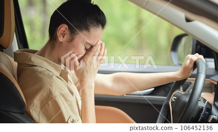 Brunette woman mad at driver clipping car on roadway 106452136