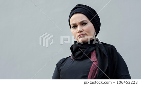 Muslim woman in hijab as representative of world feminism 106452228