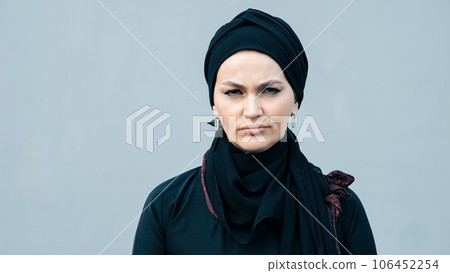face of serious oppressed feminist woman in Muslim country. 106452254