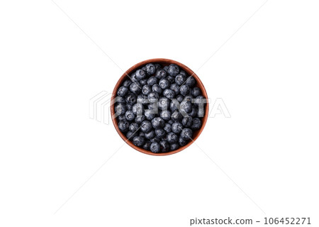 Delicious fresh sweet blueberries in a ceramic bowl. Vegan food Delicious fresh sweet blueberries in a ceramic bowl. Vegan food 106452271