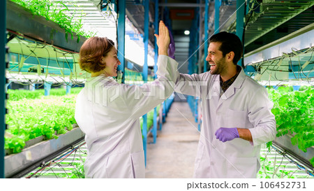 Happy scientists with indoor farm factory, Smart farm with technology 106452731