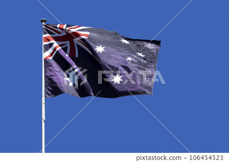 Australian flag waving atop of its pole Australian flag waving atop of its pole 106454523