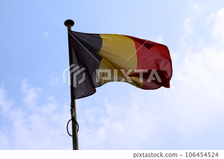 Belgium flag waving atop of its pole Belgium flag waving atop of its pole 106454524