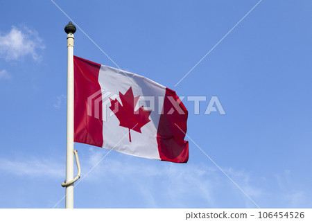 Canadian lag waving atop of its pole Canadian lag waving atop of its pole 106454526