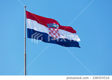 Croatian flag waving atop of its pole 106454528