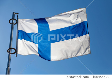 Finnish flag waving atop of its pole Finnish flag waving atop of its pole 106454529