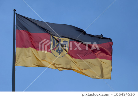 German flag waving atop of its pole German flag waving atop of its pole 106454530