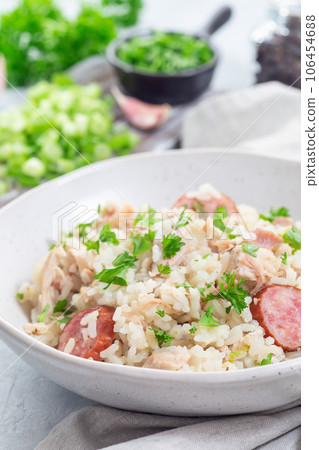 Chicken bog dish with smocked sausages, traditional South Carolina recipe, in bowl, vertical Chicken bog dish with smocked sausages, traditional South Carolina recipe, in bowl, vertical 106454688