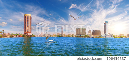 View on the Nile with a sailboat, TV tower and the river bank, Cairo, Egypt 106454887