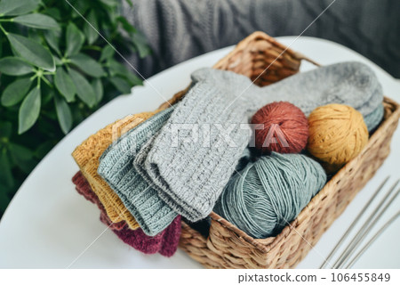 Hand-knitted woolen socks of different colors 106455849