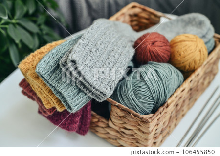 Hand-knitted woolen socks of different colors 106455850