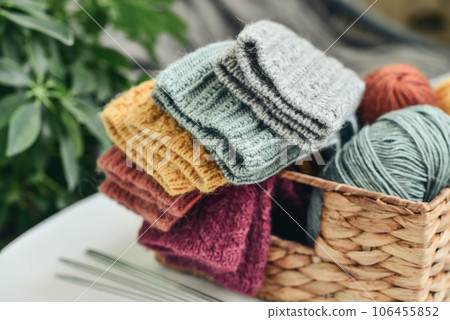 Hand-knitted woolen socks of different colors Hand-knitted woolen socks of different colors 106455852