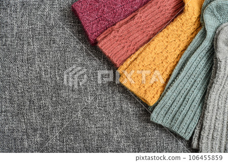 Hand-knitted woolen socks of different colors 106455859