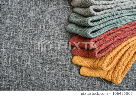 Hand-knitted woolen socks of different colors 106455865