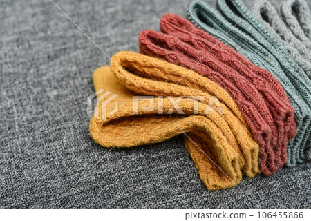 Hand-knitted woolen socks of different colors 106455866