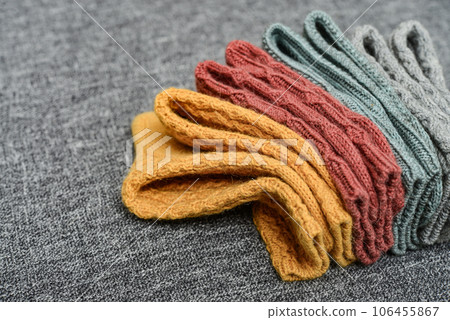 Hand-knitted woolen socks of different colors Hand-knitted woolen socks of different colors 106455867