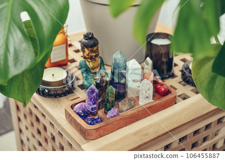 Various minerals and healing crystals on a wooden tray Various minerals and healing crystals on a wooden tray 106455887