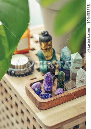 Various minerals and healing crystals on a wooden tray 106455888