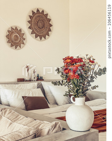 Bouquet of orange chrysanthemums in bedroom 106456119