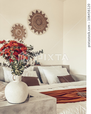 Bouquet of orange chrysanthemums in bedroom Bouquet of orange chrysanthemums in bedroom 106456120