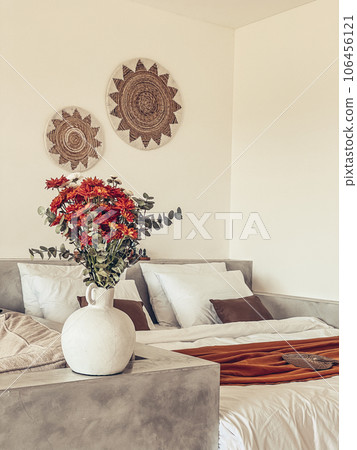 Bouquet of orange chrysanthemums in bedroom Bouquet of orange chrysanthemums in bedroom 106456121