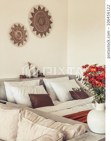 Bouquet of orange chrysanthemums in bedroom 106456122