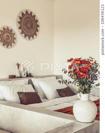 Bouquet of orange chrysanthemums in bedroom 106456123