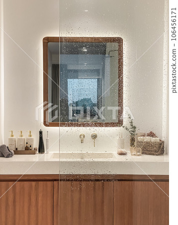 Modern bathroom  with golden modern mixer tap 106456171