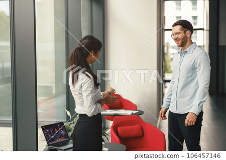 HR manager invites a candidate for a vacancy to sit down for an interview HR manager invites a candidate for a vacancy to sit down for an interview 106457146