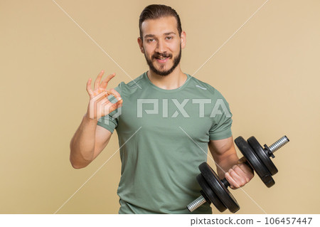 Athlete sportive man looking at camera showing ok gesture, like sign positive, feedback, celebrate Athlete sportive man looking at camera showing ok gesture, like sign positive, feedback, celebrate 106457447