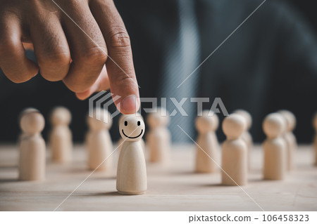 Wooden human figure touched by man hand. HR officer looks for leader and CEO. Leader breaks from crowd. Personal development, motivation, challenge. HR, HRM, HRD concepts. Human Resource Management. Wooden human figure touched by man hand. HR officer looks for leader and CEO. Leader breaks from crowd. Personal development, motivation, challenge. HR, HRM, HRD concepts. Human Resource Management. 106458323