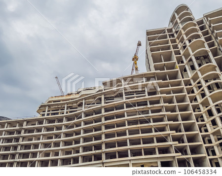 Massive concrete house taking shape, a work in progress. Construction site showcases modern design and sturdy architecture Massive concrete house taking shape, a work in progress. Construction site showcases modern design and sturdy architecture 106458334