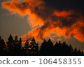 clouds lit by a fiery sunset 106458355