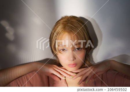 Fashion portrait image of a woman with light and shadow Fashion portrait image of a woman with light and shadow 106459502