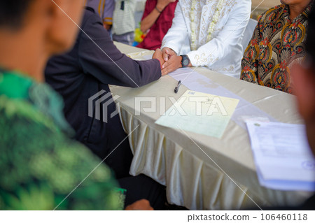 Akad nikah is an Islamic prenuptial agreement. Indonesian marriage selektive focus (Islamic marriage) Akad nikah is an Islamic prenuptial agreement. Indonesian marriage selektive focus (Islamic marriage) 106460118