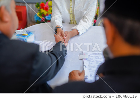 Akad nikah is an Islamic prenuptial agreement. Indonesian marriage selektive focus (Islamic marriage) Akad nikah is an Islamic prenuptial agreement. Indonesian marriage selektive focus (Islamic marriage) 106460119