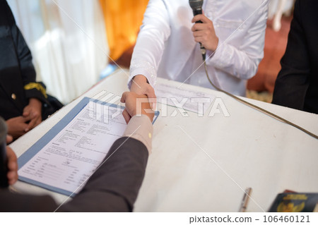 Akad nikah is an Islamic prenuptial agreement. Indonesian marriage selektive focus (Islamic marriage) Akad nikah is an Islamic prenuptial agreement. Indonesian marriage selektive focus (Islamic marriage) 106460121