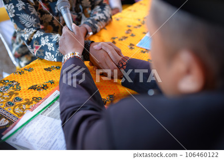 Akad nikah is an Islamic prenuptial agreement. Indonesian marriage selektive focus (Islamic marriage) Akad nikah is an Islamic prenuptial agreement. Indonesian marriage selektive focus (Islamic marriage) 106460122
