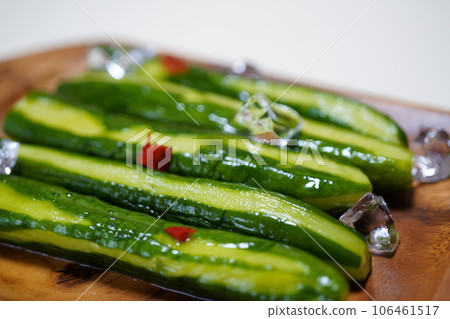 Pickled cucumber in a wooden bowl Pickled cucumber in a wooden bowl 106461517