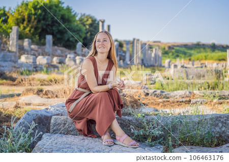Pretty tourist woman at the ruins of ancient city of Perge near Antalya Turkey Pretty tourist woman at the ruins of ancient city of Perge near Antalya Turkey 106463176