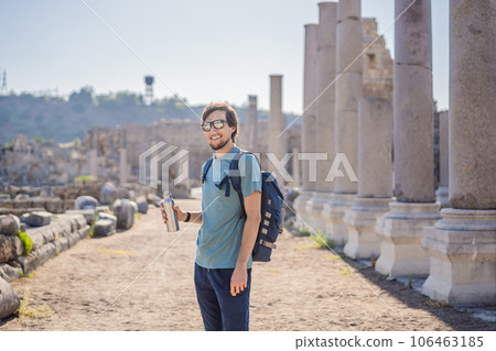 Tourist man at the ruins of ancient city of Perge near Antalya Turkey Tourist man at the ruins of ancient city of Perge near Antalya Turkey 106463185