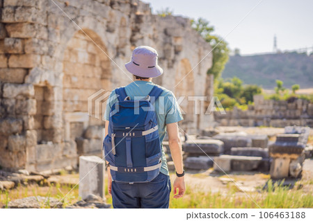 Tourist man at the ruins of ancient city of Perge near Antalya Turkey 106463188