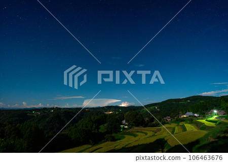 Night view image of terraced rice fields during the harvest season illuminated by moonlight [Misaki Town, Okayama Prefecture] 106463676