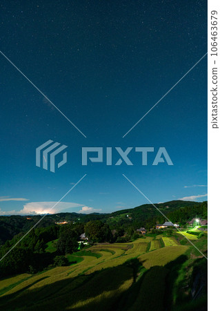 Night view image of terraced rice fields during the harvest season illuminated by moonlight [Misaki Town, Okayama Prefecture] 106463679