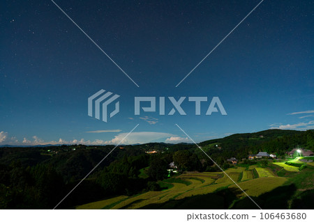 Night view image of terraced rice fields during the harvest season illuminated by moonlight [Misaki Town, Okayama Prefecture] 106463680