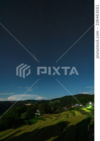 Night view image of terraced rice fields during the harvest season illuminated by moonlight [Misaki Town, Okayama Prefecture] 106463681