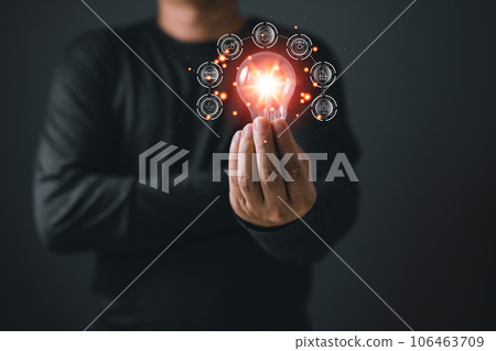 person hand holding power lightbulb and reduce global warming,climate change,ecology friendly investment,ESG environment social governance,Green Business Innovation and Sustainable Development concept person hand holding power lightbulb and reduce global warming,climate change,ecology friendly investment,ESG environment social governance,Green Business Innovation and Sustainable Development concept 106463709