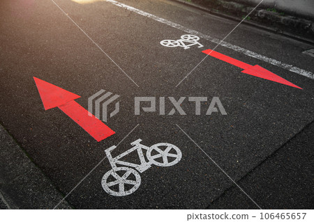 bike lane two ways sign direction arrow symbol paint on asphalt road in japan city metro 106465657